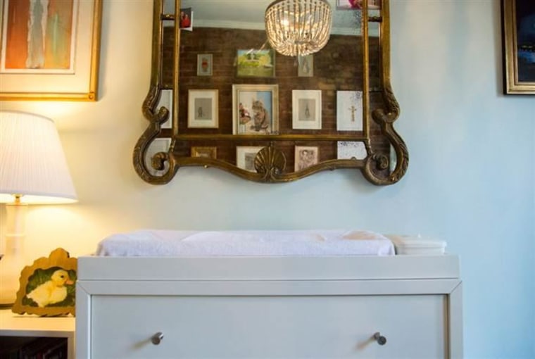 A vintage mirror sits above the changing table in Jenna Bush Hager's home.