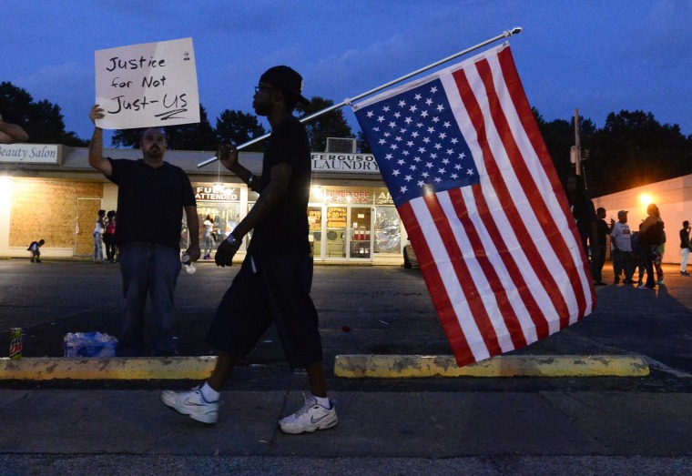 Image: emonstrators march in protest over the shooting death of Michael Brown in Ferguson