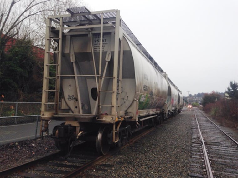 Firefighters rescued a man trapped head first down a narrow steel chute. The man’s head was popping out through the bottom of the chute underneath the train. The man’s feet were popping out of the top of the chute. 