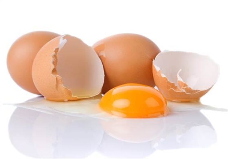 Chicken eggs and yolk isolated on white background