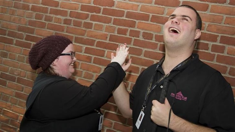 Katie Faughnan and Thomas Acocella high-five each other for a job well done.