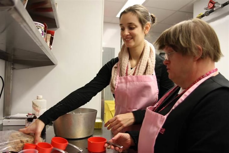 Ashley Shriver and Grace Kolf help create the Prospector's popular caramel corn.