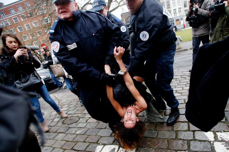 Image:  FEMEN protester is arrested in Lille, France