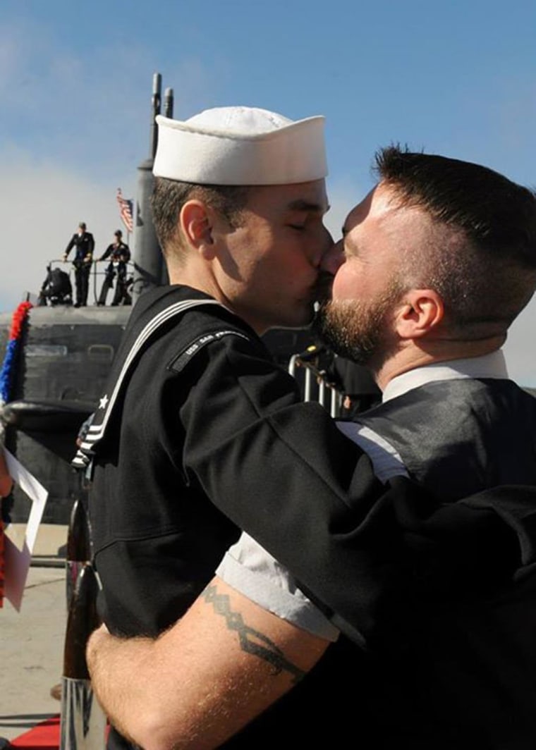 Petty Officer 2nd Class Thomas Sawicki shares "first kiss" with his boyfriend following his return to Naval Base Point Loma in San Diego.