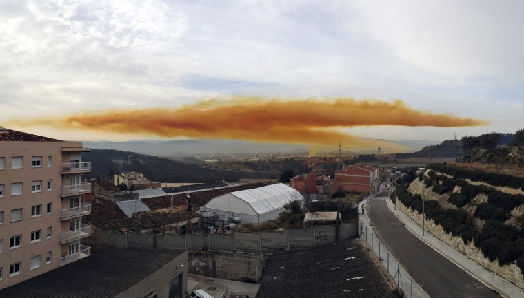 Image: Orange toxic cloud is seen over the town of Igualada, near Barcelona, following an explosion in a chemical plant