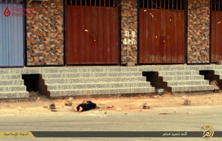 Image: Photo released by ISIS appears to show the body of an alleged gay man after his execution