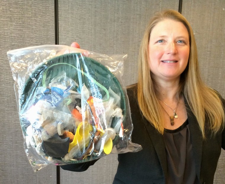 Image: Jenna Jambeck with plastic trash