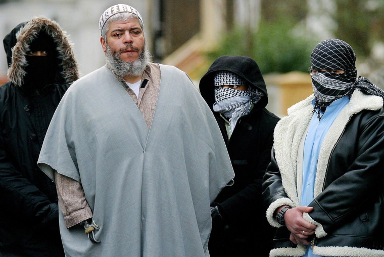 Image: Abu Hamza surrounded by supporters outside the Finsbury Park Mosque on Feb. 7, 2003