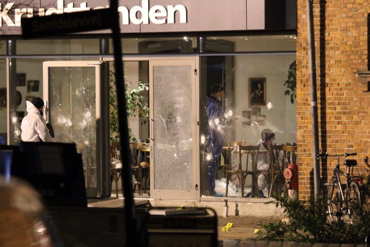 Image: Forensic investigators are seen at the site of a shooting in Copenhagen