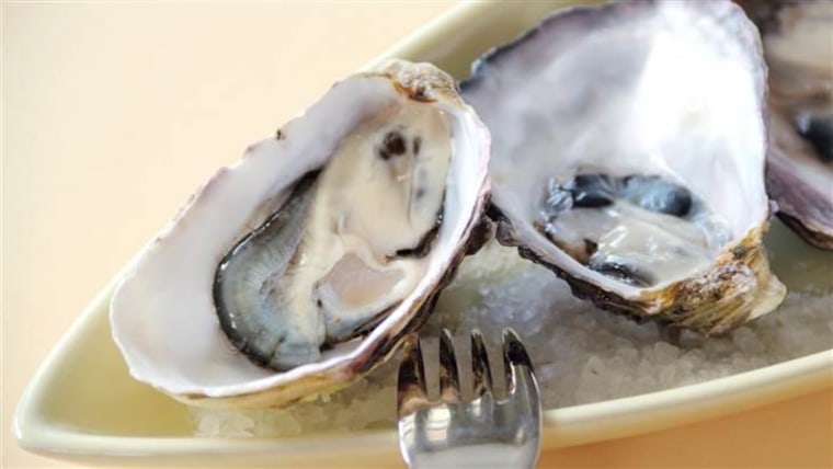 Fresh natural oysters in their shells ready to serve.