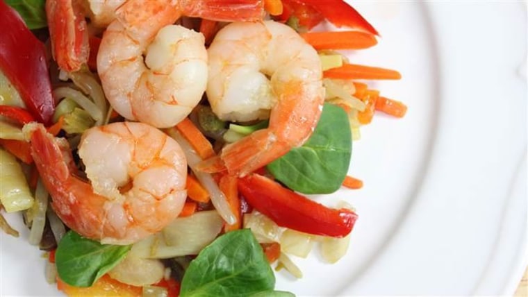 Fried shrimp on a salad of steamed vegetables; Shutterstock ID 129319094; PO: today.com