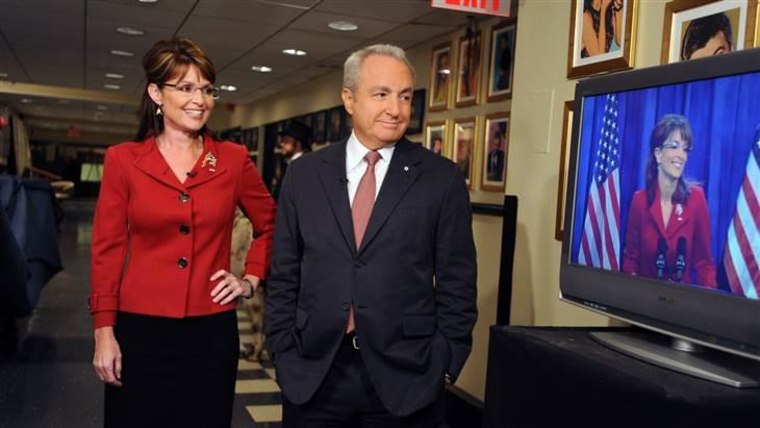 Alaska Governor Sarah Palin and Lorne Michaels watch Tina Fey as Palin in 2008.