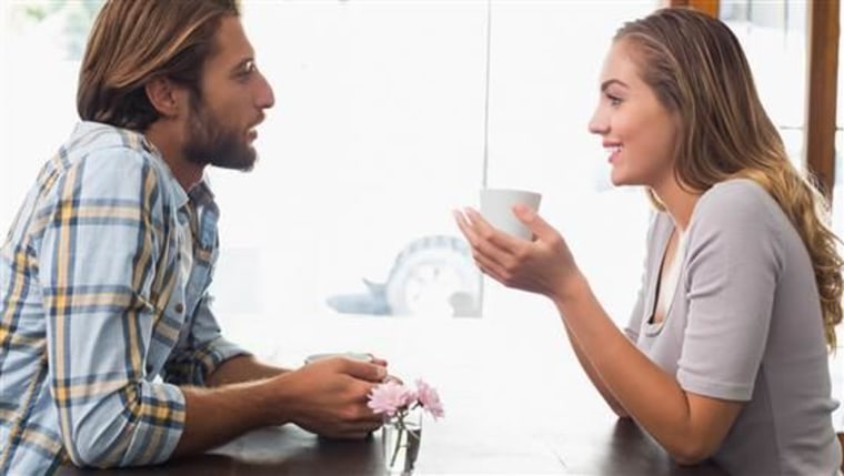 Happy couple enjoying a coffee at the coffee shop; activities; adult; and; attractive; beautiful; bright; business; cafe; cafeteria; caucasian; cheerf...