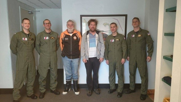 Reg and Jason McGlashan with the Coast Guard crew that rescued them.