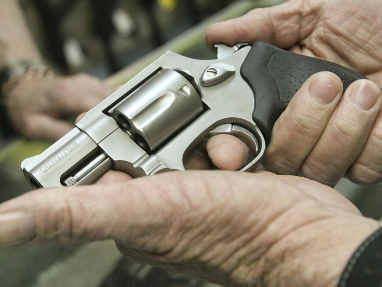 Ray Scott looks at a Tarus .38 Special Revolver, Thursday at Tommy "Hoss Fly" Atchison Guns & Trade, Inc. in Midland, Texas. 

