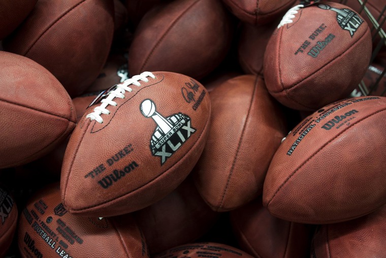 Image: Footballs sit inside of a bin waiting to be inspected before they are shipped inside of the Wilson Sporting Goods Football Factory in Ada, Ohio