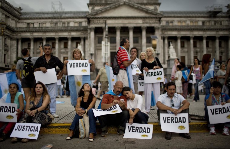 Image: People gather to demand answers from the government