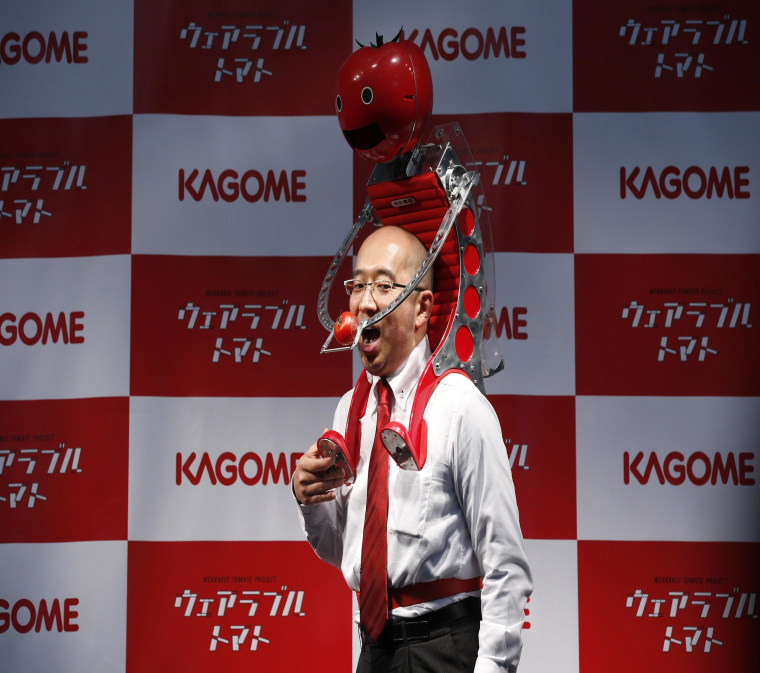 Image: Kagome Co's employee Shigenori Suzuki poses with the device