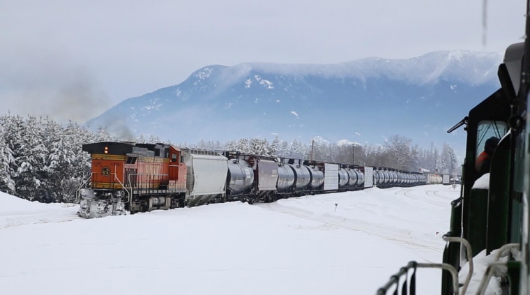 Image: A BNSF oil train heads west through Whitefish, Montana.