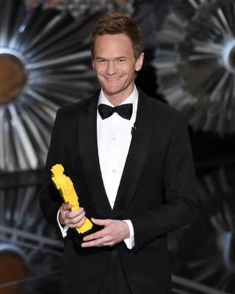 Host Neil Patrick Harris holds a Lego Oscar statuette at the Oscars. (Photo by John Shearer/Invision/AP)