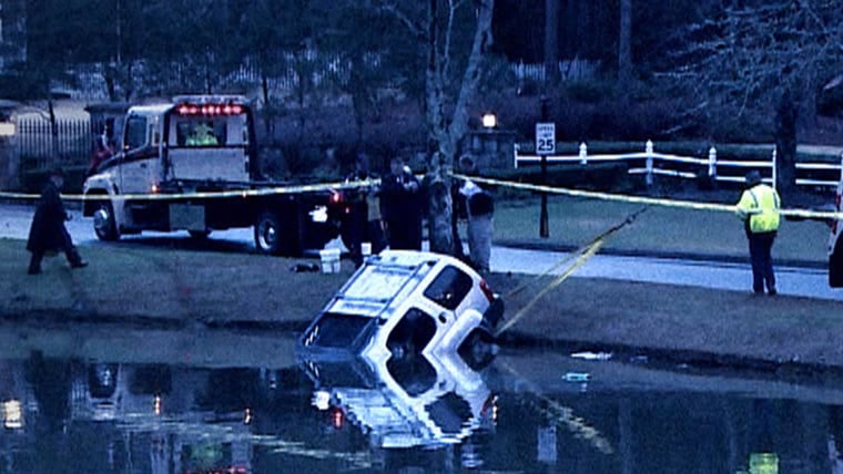 Emergency personnel haul Shanell Anderson's SUV out of a pond near Atlanta. They arrived too late to save her life.