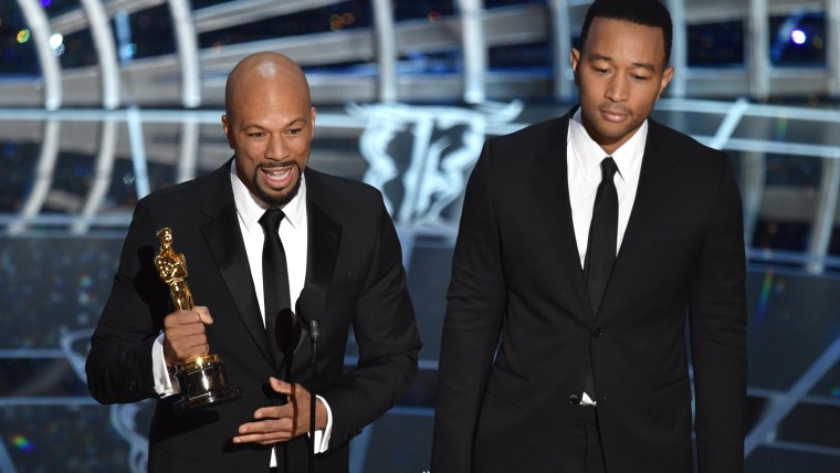 Common, left, and John Legend accept the Academy Award for best original song