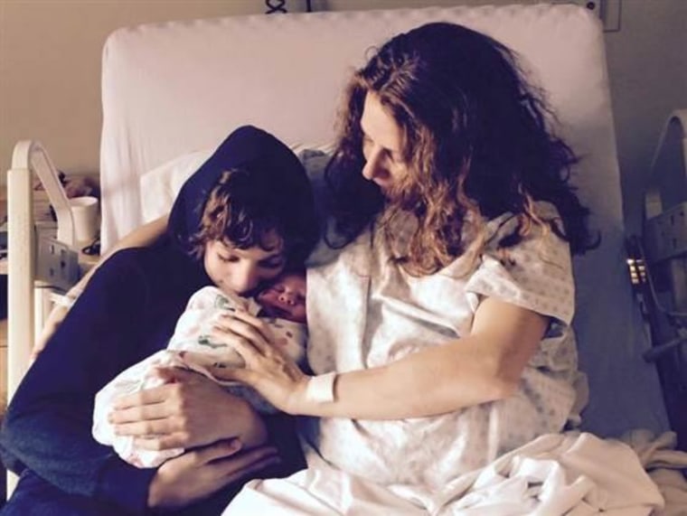 Christy Owens with her son Julian Valencheck, 11, and newborn Ikechi; she talked to all of her children while in her belly. After Julian was born at 26, Owens talked and read to him in the NICU, which she believes helped him.