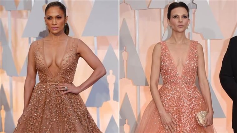 Jennifer Lopez (L) and Robert Duvall's wife Luciana picked nearly identical gowns for the Oscars red carpet.