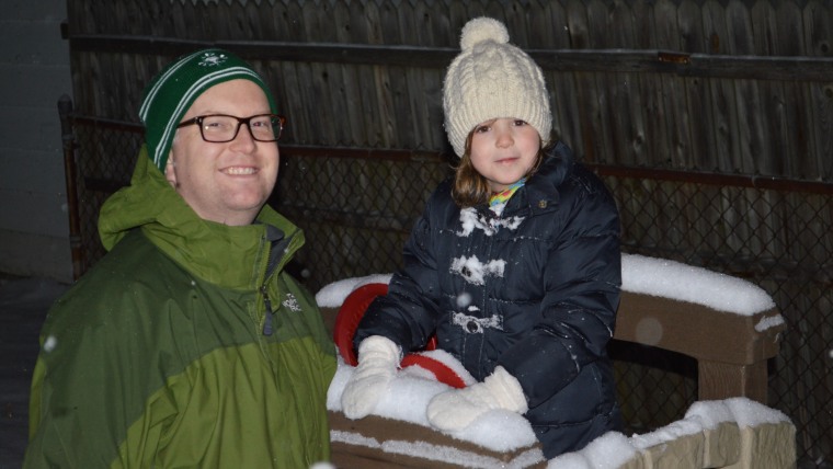 Dennis Rhoney and his daughter, after playing in the snow.