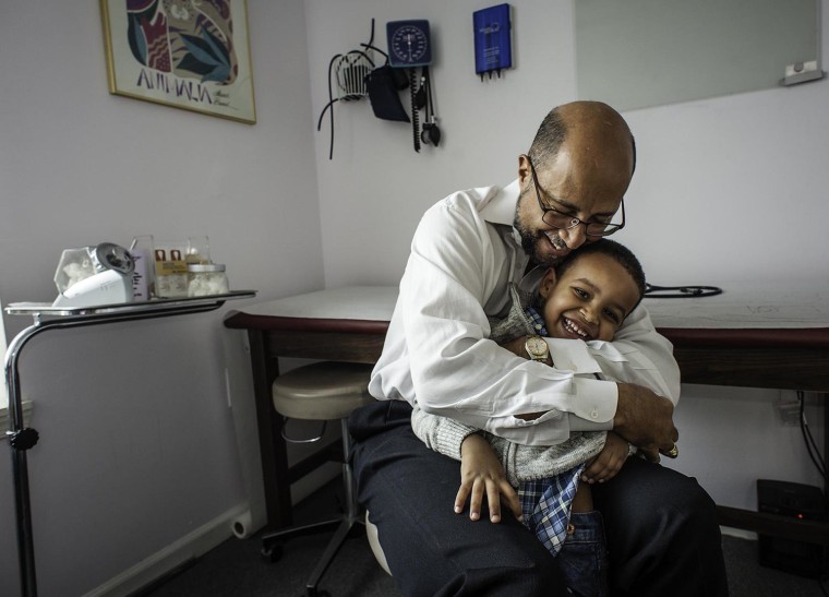 Image: Dr. Michael Darden's uncommon bedside manner was on display in a viral video when he gave toddler, Noah Raey (cq) his vaccinations.