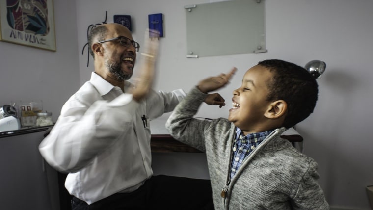 Image: Dr. Michael Darden's uncommon bedside manner was on display in a viral video when he gave toddler, Noah Raey (cq) his vaccinations.