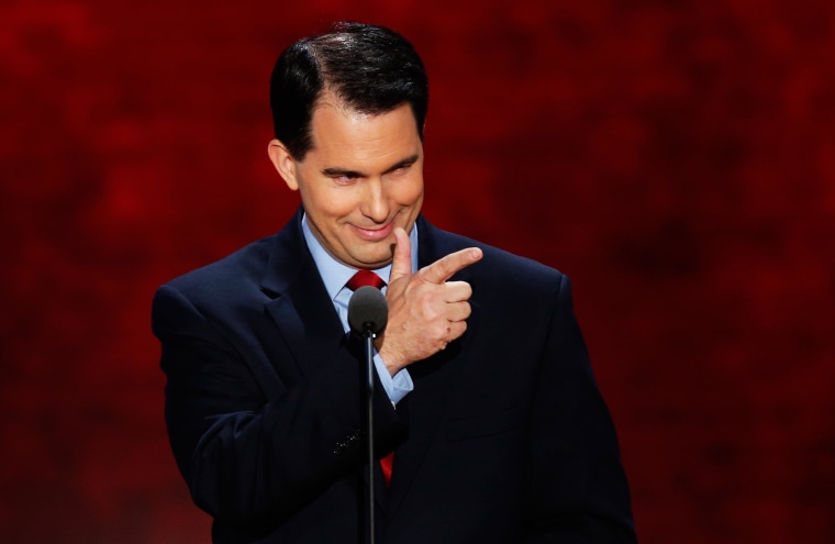 Image: Wisconisn Governor Scott Walker gestures as he addresses the second session of the Republican National Convention in Tampa