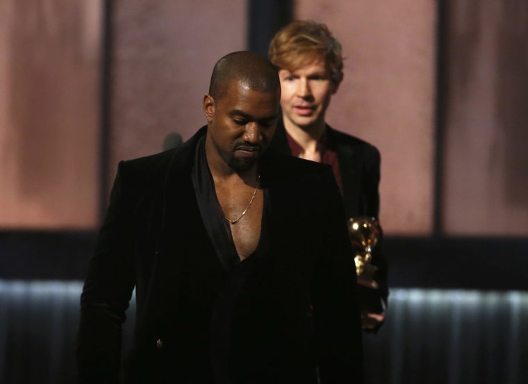 Image: Beck watches Kanye West after Beck won album of the year for \"Morning Phase,\" at the 57th annual Grammy Awards in Los Angeles