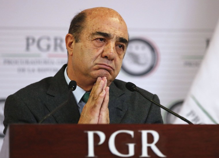 Image: Attorney General Jesus Murillo listens during a news conference at the attorney general's office in Mexico City