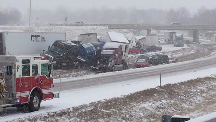 Tractor-trailers and cars are seen on Interstate 44 in Missouri after a chain-reaction crash near Rolla, Missouri, Saturday.