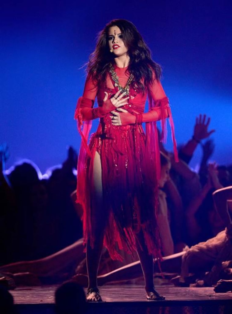 Selena Gomez performs onstage during the 2013 MTV Movie Awards.