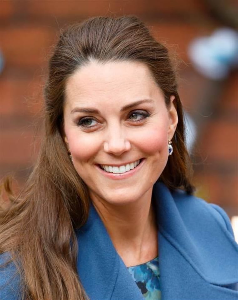 Duchess Kate sports gray roots on Feb. 18 while visiting the Emma Bridgewater pottery factory, which supports the East Anglia's Children's Hospices.