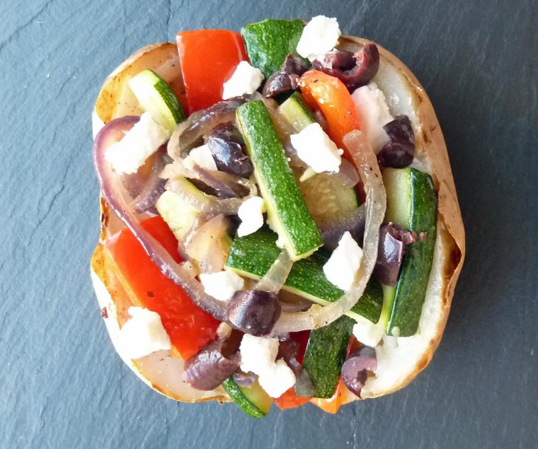Baked potato with vegetables, feta and olives