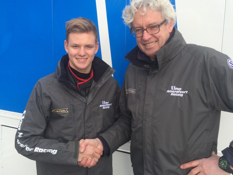German driver Mick Schumacher, left, shakes hands with Van Amersfoort Racing team owner Frits van Amersfoort. Schumacher will be making the transition from karting to single-seater racing with the Dutch team. 
