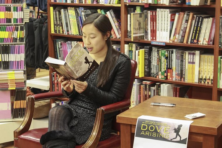 Karen Bao reads her book, "Dove Arising," at an event at Book Culture, a book store near Columbia University in New York.