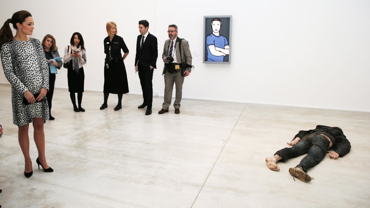 Britain's Duchess Kate looks at "Self Portrait as a Drowned Man" by Jeremy Millar during a visit to Turner Contemporary in Margate