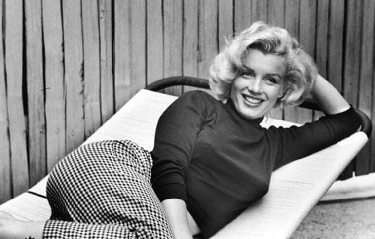 Actress Marilyn Monroe at home.