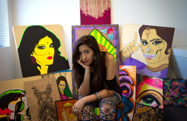 Nisha with her work at her studio in Emeryville, Calif.
