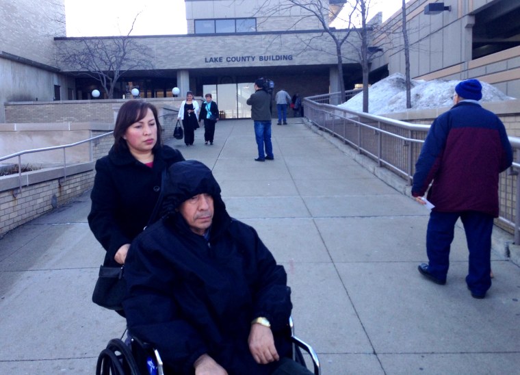 Angel Gonzalez Sr. is wheeled from the Lake County Courthouse where his son was exonerated Monday of a conviction in a 1994 abduction and rape for which he served 20 years of a 40-year sentence.