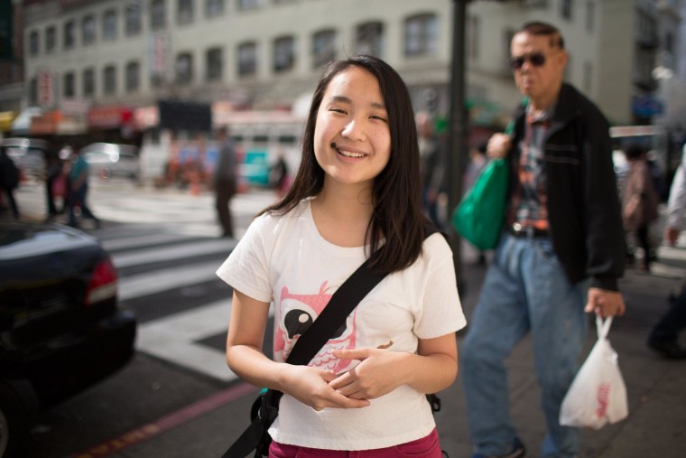 Image:Rosa Chen stands in Chinatown where she gives historical tours with the Chinatown Community Development Center.