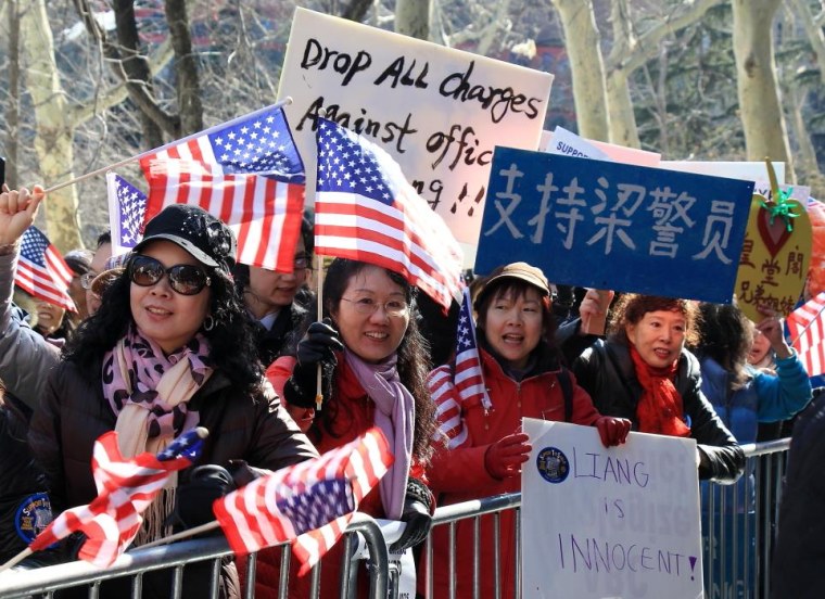 Supporters rally for NYPD Officer Peter Liang, indicted for the Brooklyn shooting of Akai Gurley, an unarmed man.