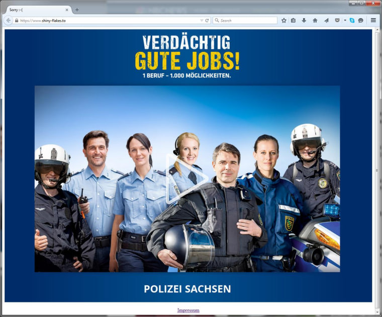 Image: Visitors of the Shinky Flakes website are now greeted by a photo of smiling police officers.