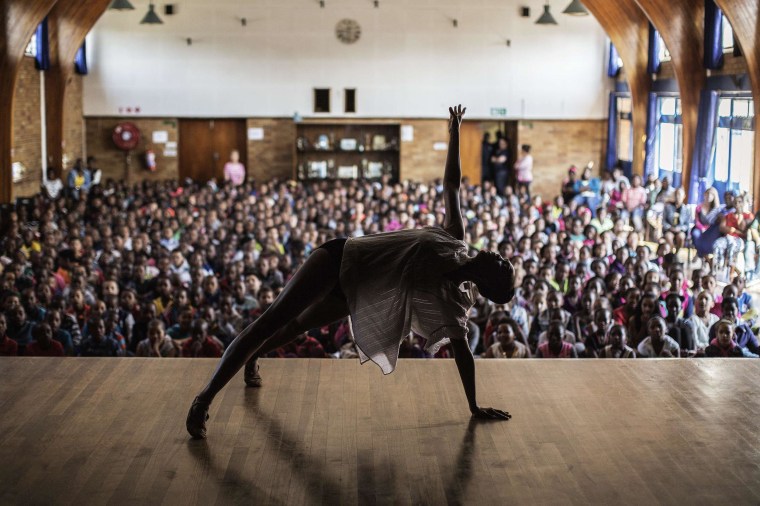 Image: Joburg Ballet Senior soloist Kitty Phetla performs in front of an audience of school children