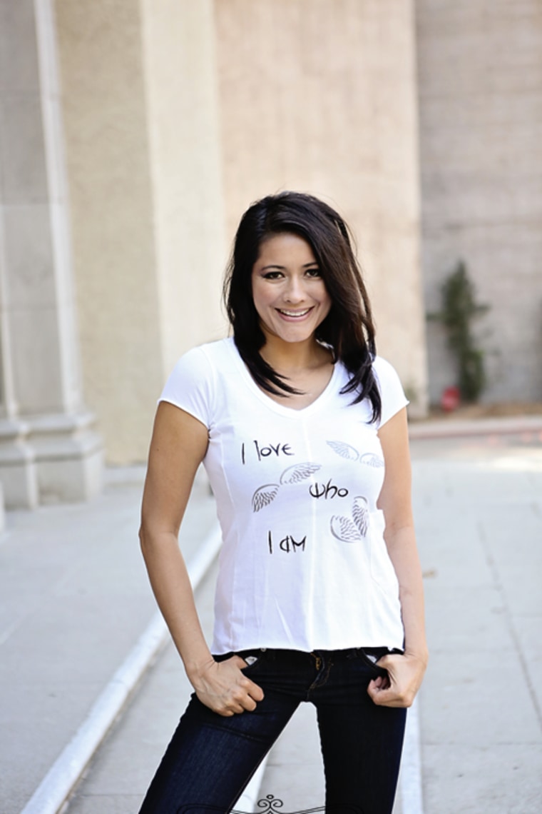 A model dons the original "I love who I am" T-shirt designed by Passeri.