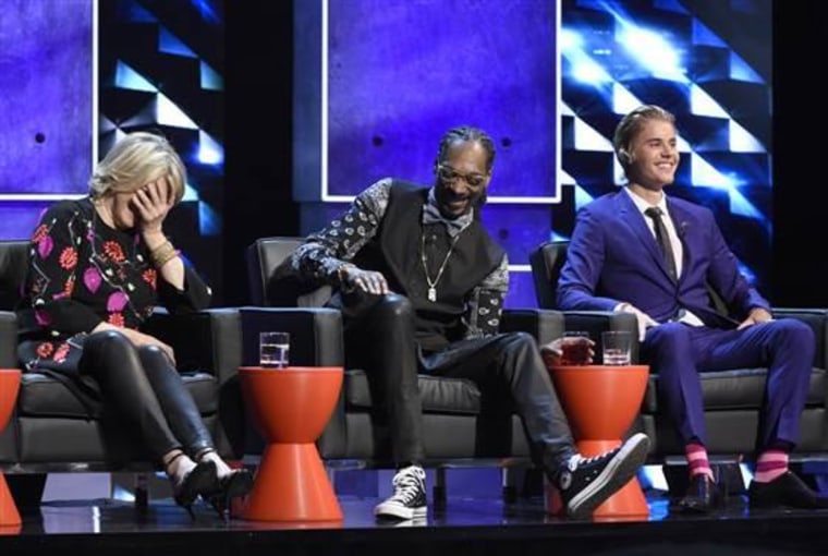 Martha Stewart, from left, Snoop Dogg and Justin Bieber appear on stage at the Comedy Central Roast of Justin Bieber at Sony Pictures Studios on Saturday, March 14, 2015, in Culver City, Calif. (Photo by Chris Pizzello/Invision/AP)